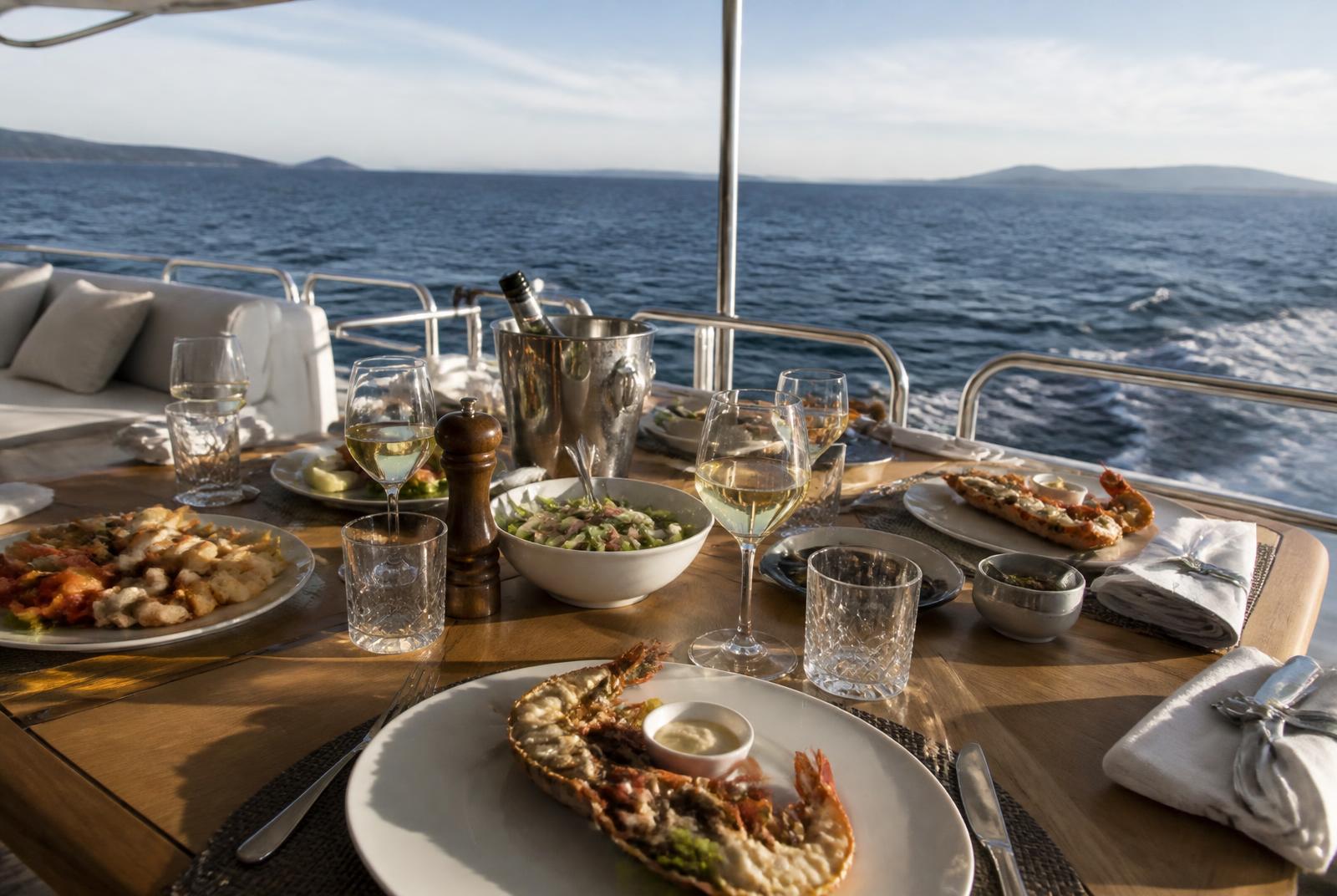 All meals included: fresh seafood and chilled drinks served on the aft deck.